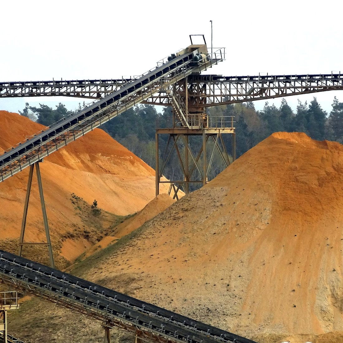 A conveyor piling sand and gravel at a quarry