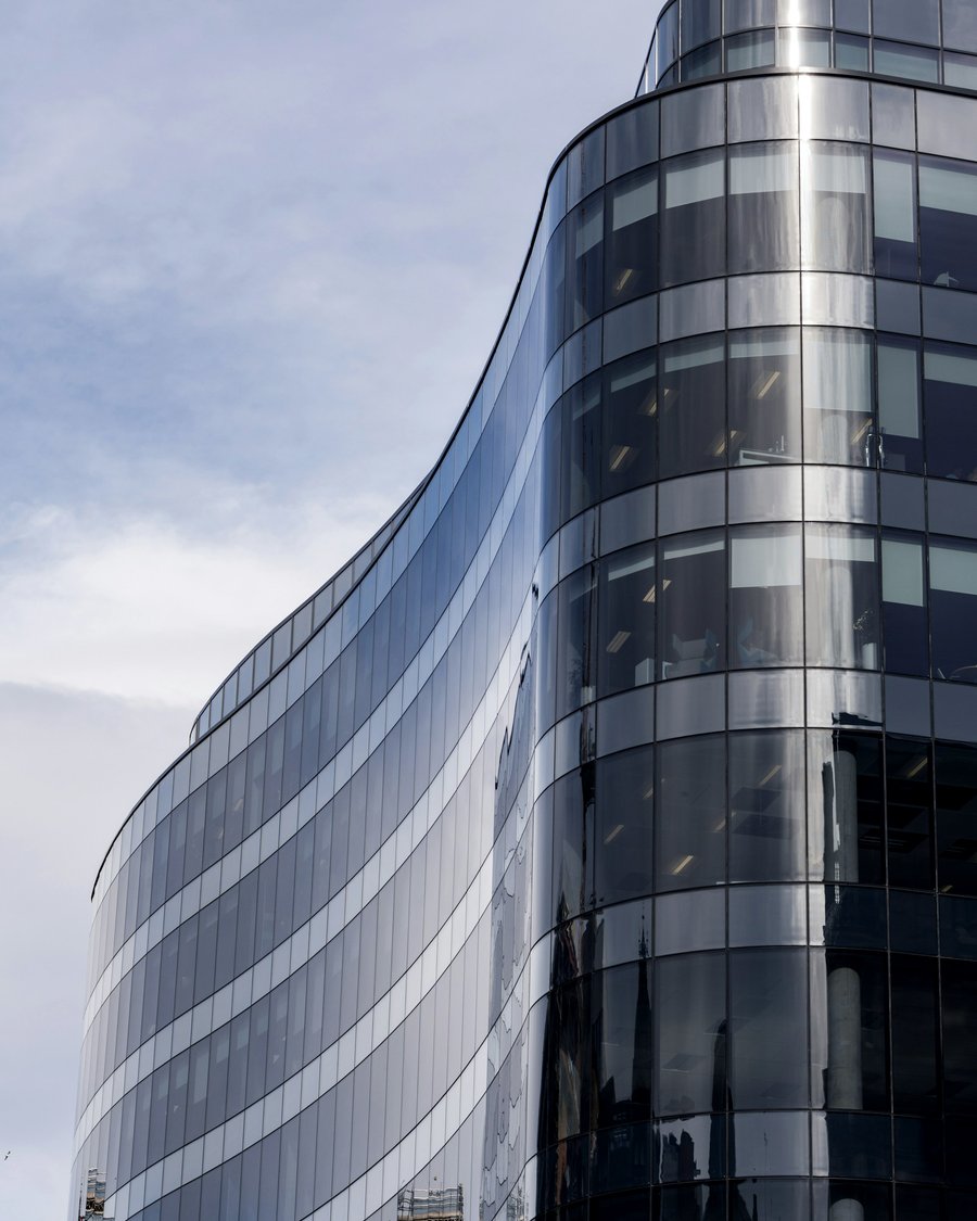 A curved glass office tower